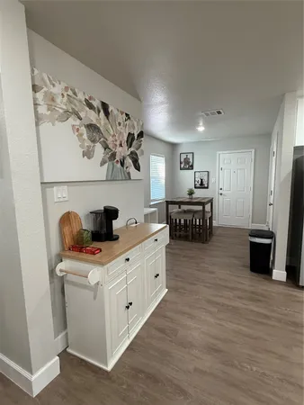 a kitchen with stainless steel appliances a white stove top oven and a refrigerator