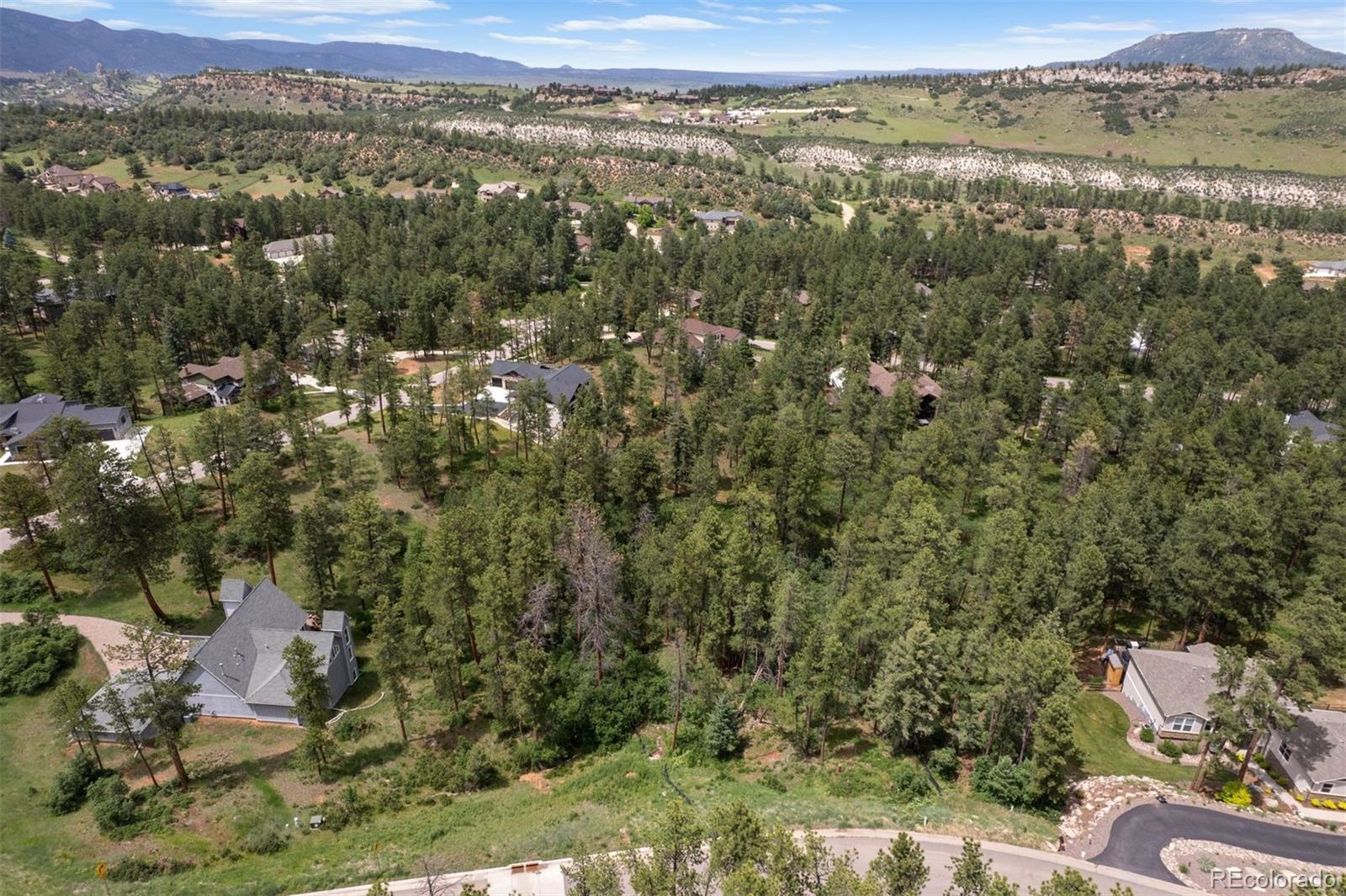 8058 Inca Road Larkspur, CO 80118 - Photo 2 of 6 an aerial view of town with residential houses with outdoor space and covered
