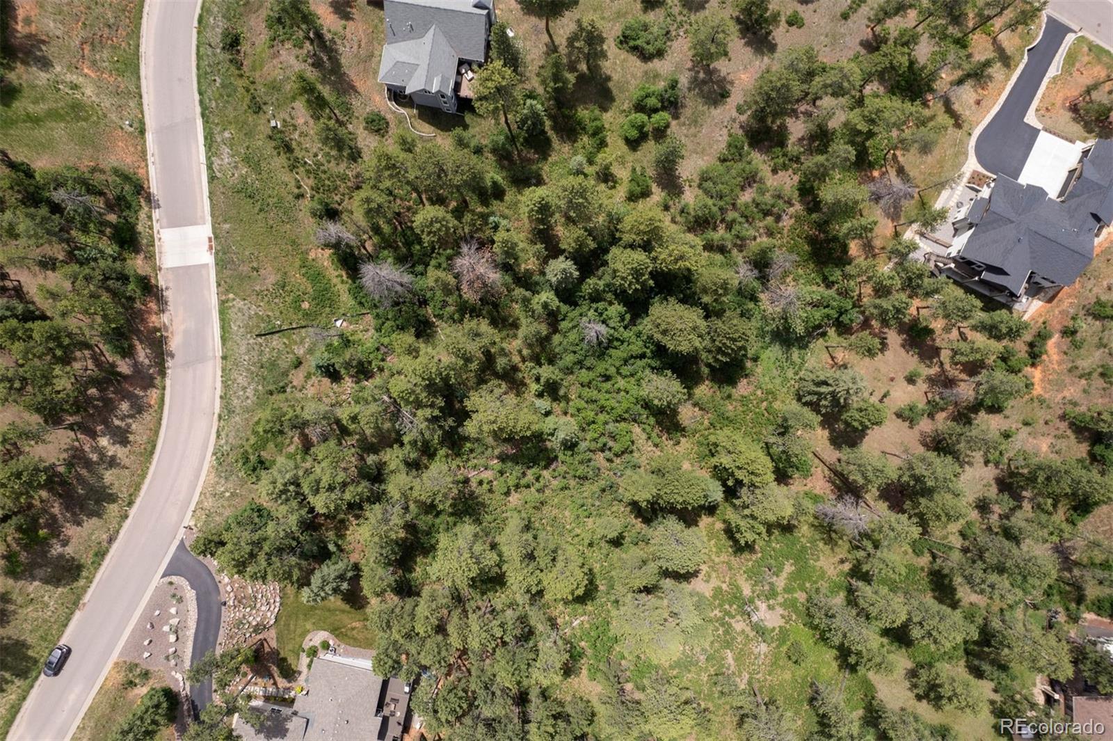 8058 Inca Road Larkspur, CO 80118 - Photo 6 of 6 an aerial view of a residential houses with yard