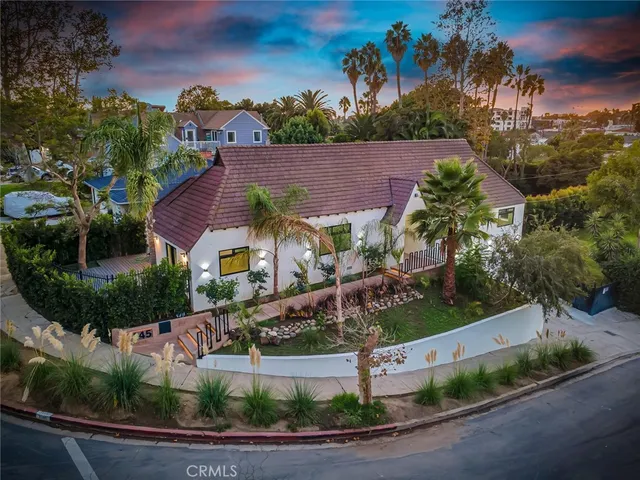 a view of backyard with wooden fence