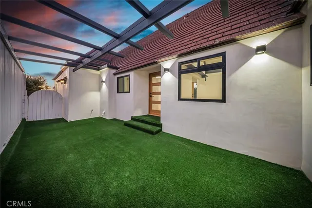 a large kitchen with stainless steel appliances granite countertop a sink and cabinets