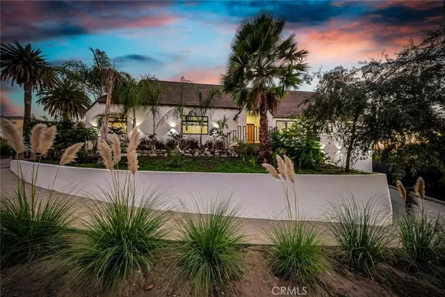 a large kitchen with stainless steel appliances granite countertop a sink stove and cabinets