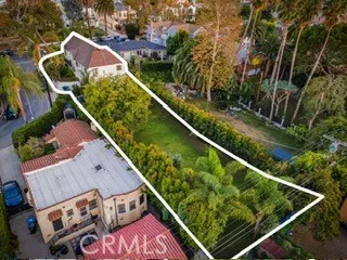 a kitchen with stainless steel appliances granite countertop a stove and white cabinets