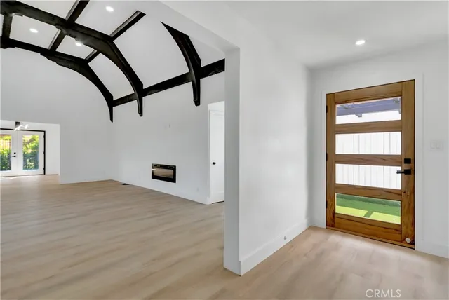 a kitchen with stainless steel appliances granite countertop a sink and dishwasher next to a large window