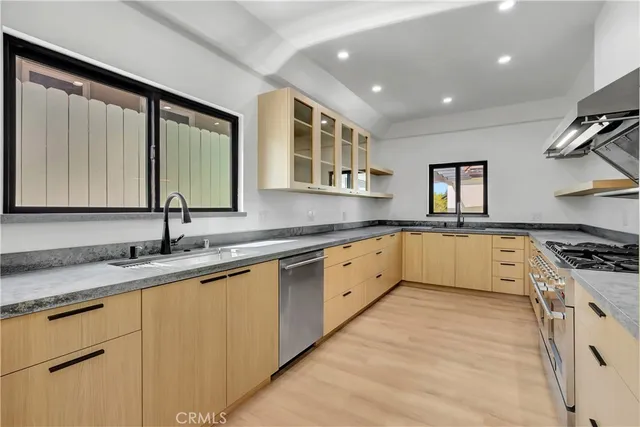 a view of a hallway with washer and dryer