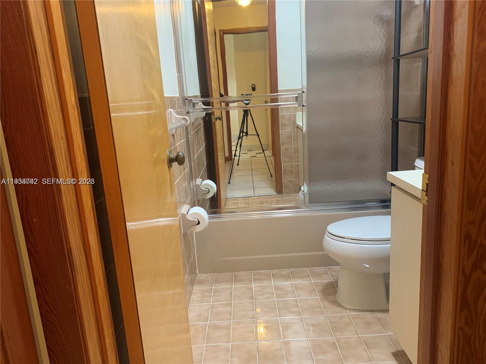 1261 Southwest 138th Court Miami, FL 33184 - Photo 9 of 11 a bathroom with a toilet and a shower