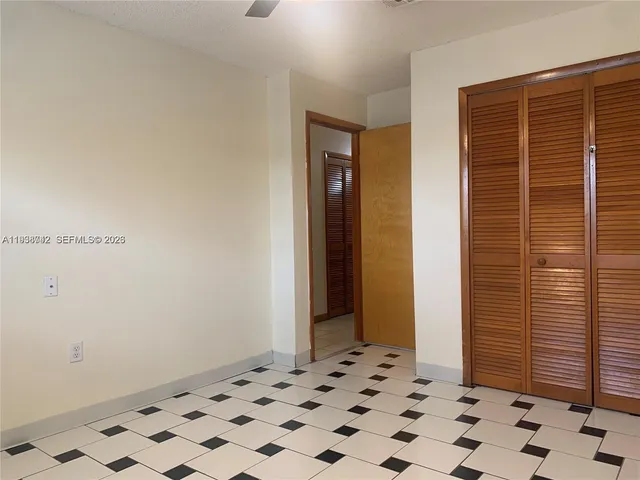 a room with a black white checkered floor