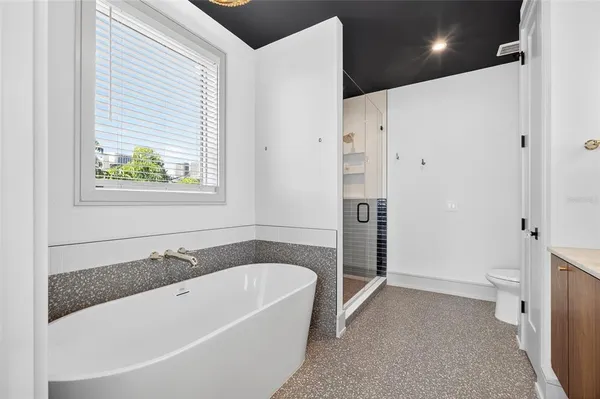 a bathroom with a bathtub and a shower