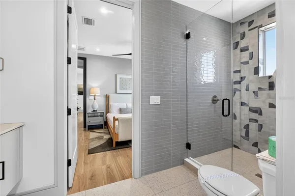 a bathroom with a sink toilet and shower