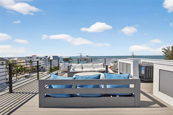 a view of a balcony with wooden floor