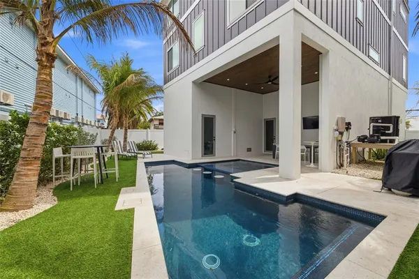 a view of swimming pool with chairs