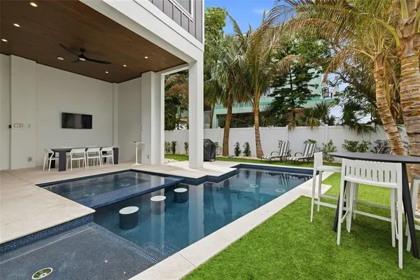 a view of swimming pool with patio