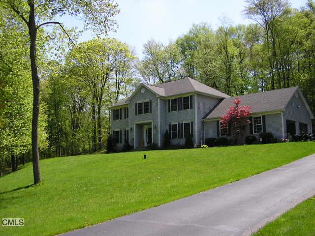 3 Shadow Ridge Circle Newtown, CT 06470 - Photo 1 of 1 a view of a white house with a big yard and potted plants and large trees