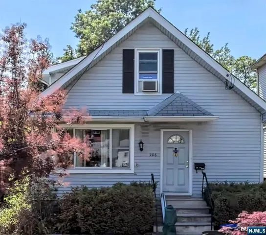 a view of a house with brick walls and potted plants