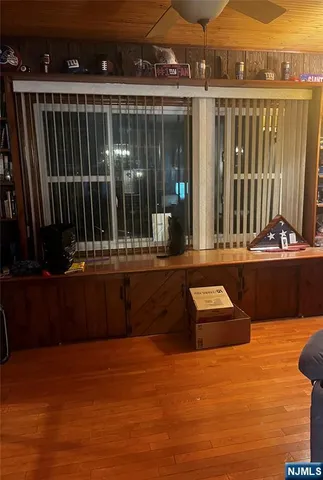 a view of swimming pool with outdoor seating and city view