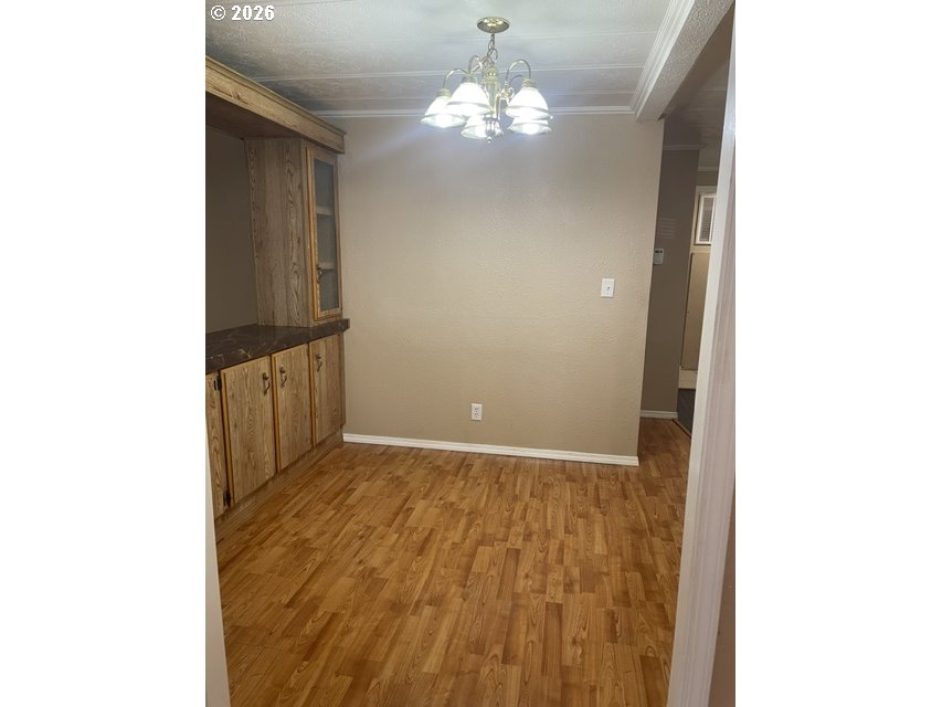 5660 Daisy Street, Unit 31 Springfield, OR 97478 - Photo 39 of 44 a view of a hallway with chandelier