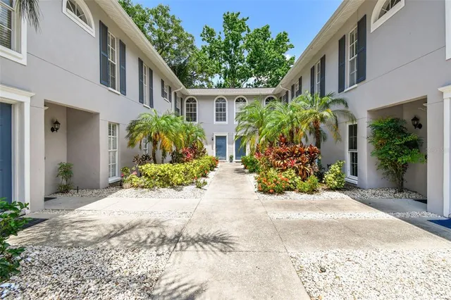 a view of house with yard and outdoor space