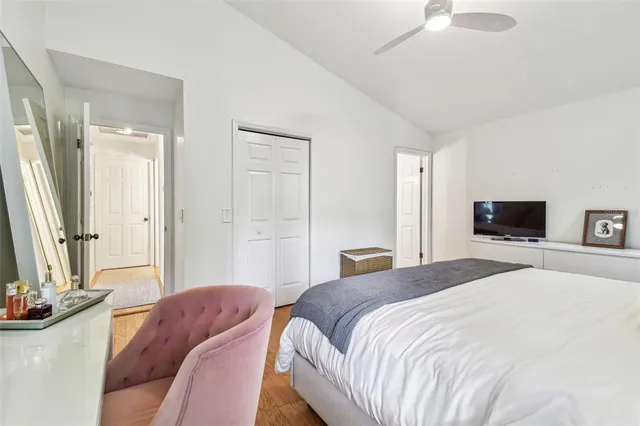 a bedroom with a bed and a television