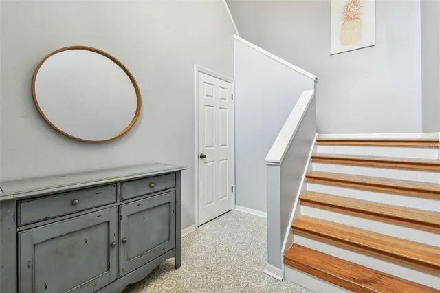 a view of a livingroom with wooden floor and white walls