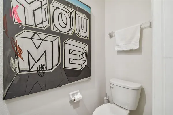 a bathroom with a toilet and a sink