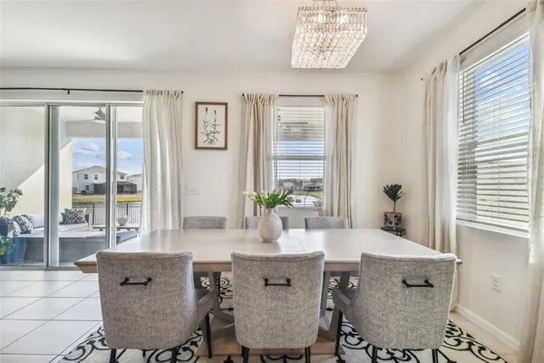 a dining room with furniture and window