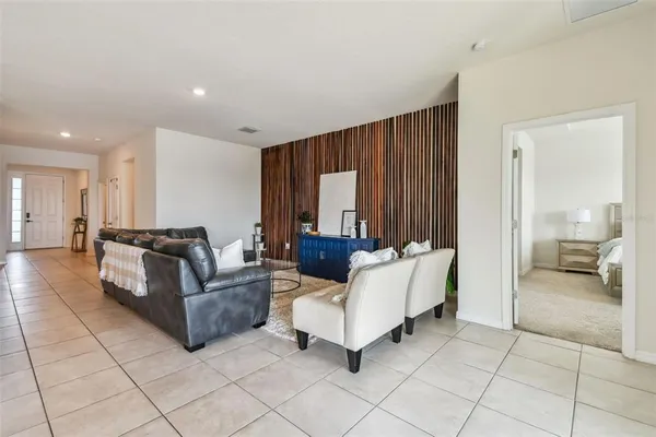 a living room with furniture and a large window