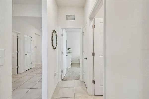 a bathroom with a granite countertop shower mirror and a sink