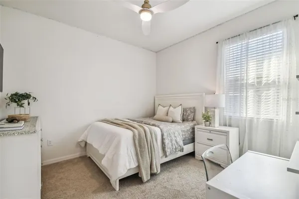 a bed room with a bed and a chandelier