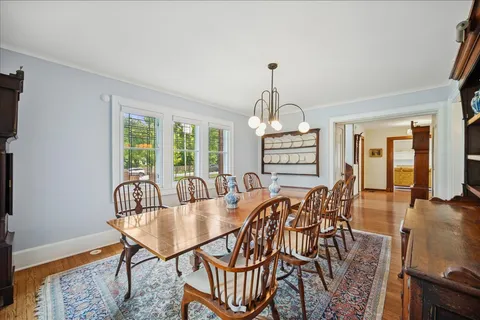 a living room with furniture fireplace and a table