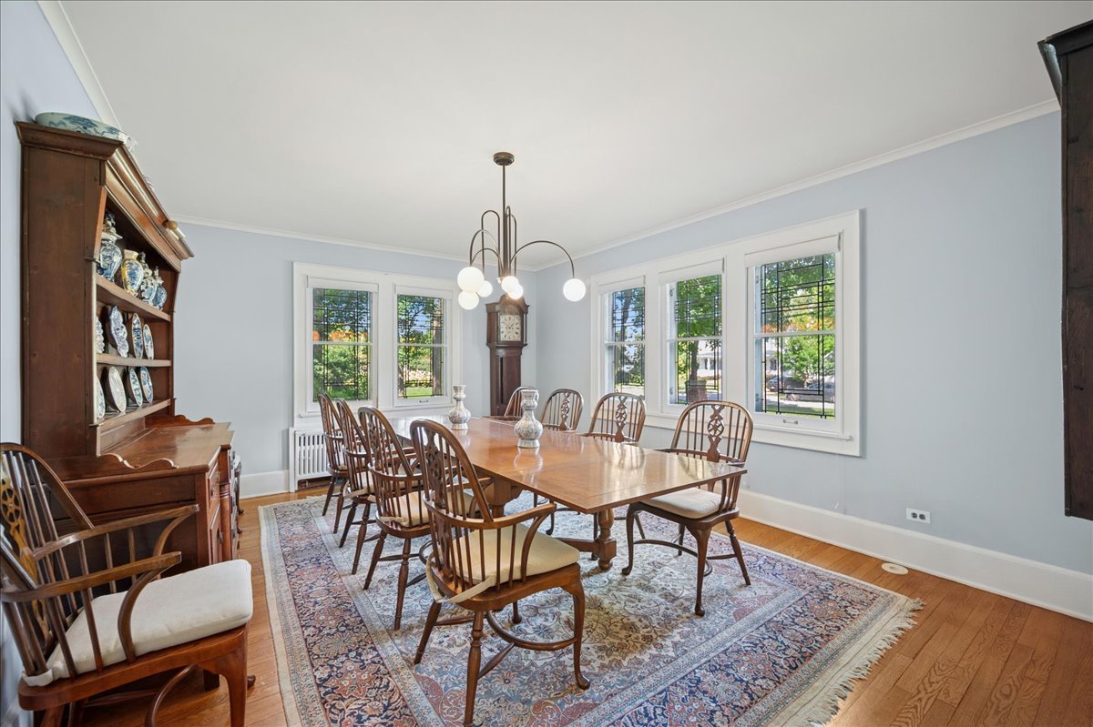 100 Old Green Bay Road Winnetka, IL 60093 - Photo 18 of 60 a view of a dining room with furniture window and wooden floor