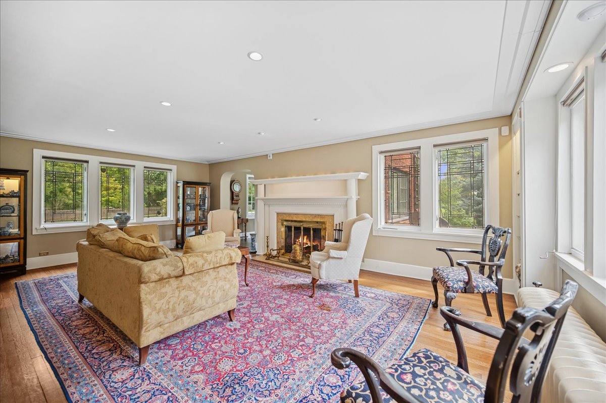 100 Old Green Bay Road Winnetka, IL 60093 - Photo 22 of 60 a living room with furniture a fireplace and a large window