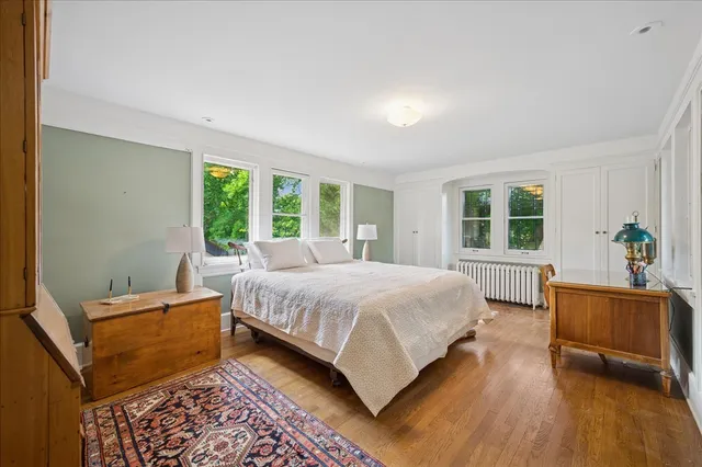 a bedroom with a bed and window