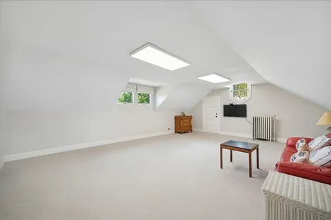 a view of a livingroom with furniture and stairs