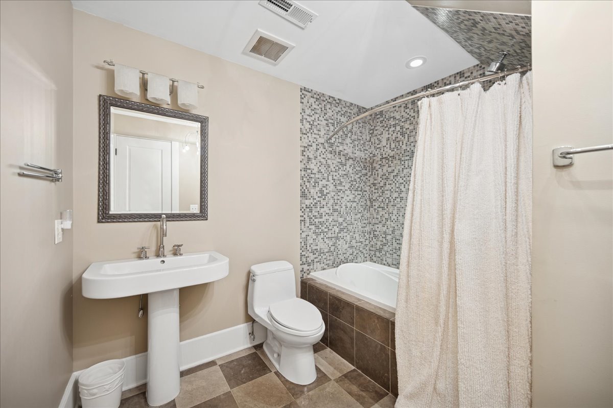 100 Old Green Bay Road Winnetka, IL 60093 - Photo 47 of 60 a bathroom with a sink toilet and shower