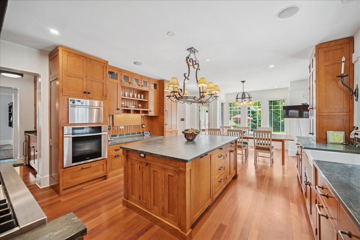 100 Old Green Bay Road Winnetka, IL 60093 - Photo 5 of 60 a kitchen with stainless steel appliances granite countertop a stove and cabinets