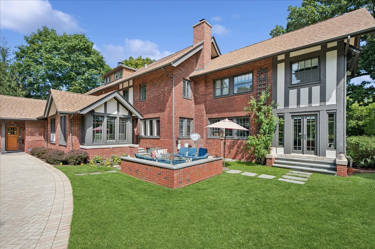 100 Old Green Bay Road Winnetka, IL 60093 - Photo 52 of 60 a front view of a house with a yard table and chairs