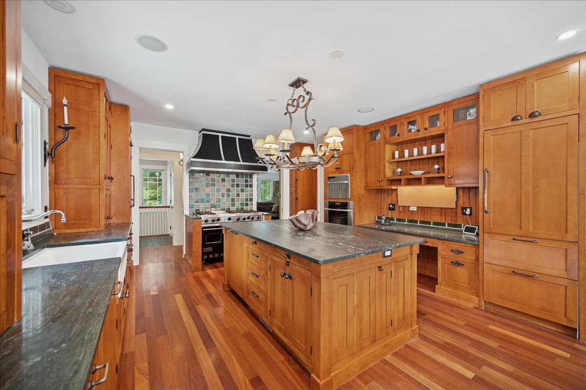 100 Old Green Bay Road Winnetka, IL 60093 - Photo 8 of 60 a kitchen with stainless steel appliances a stove top oven and a refrigerator