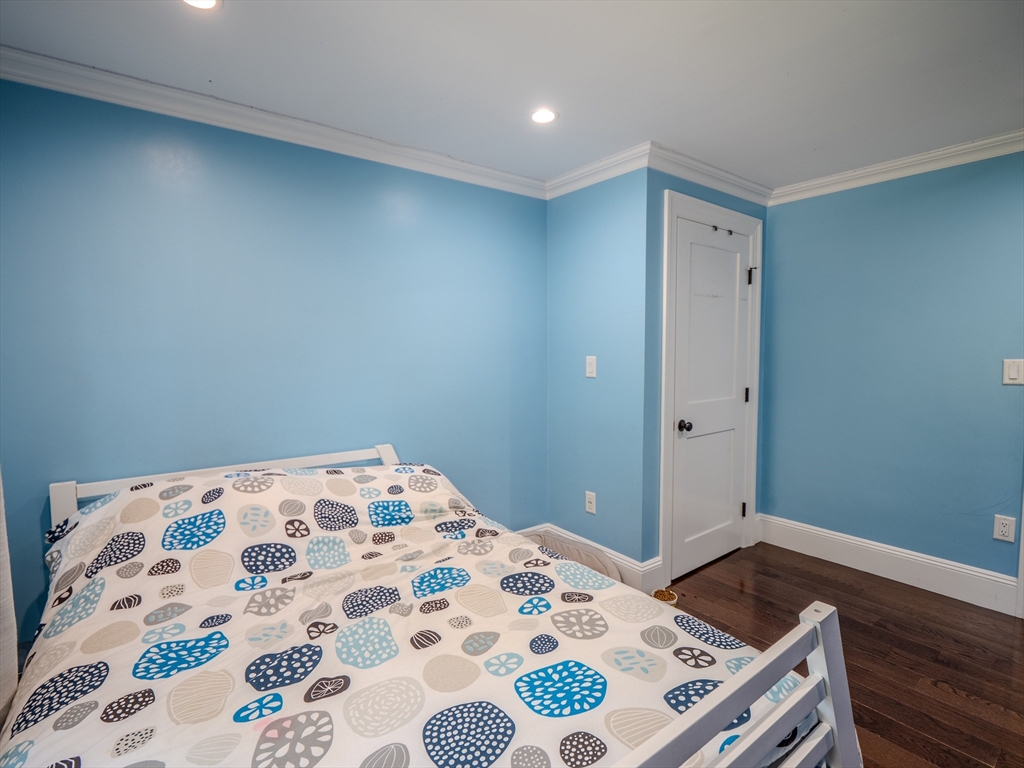 159 Mishawum Road Woburn, MA 01801 - Photo 11 of 41 a bedroom with a bed and a dresser