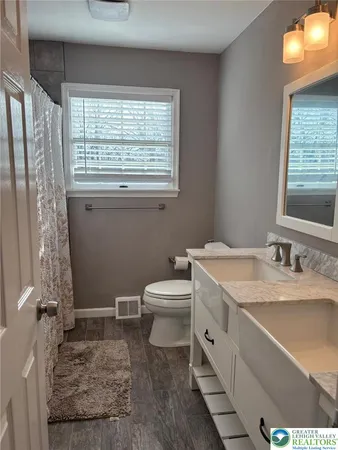 a bedroom with a large bed and a large window