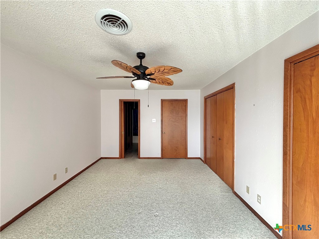 440 15th Street Port O'Connor, TX 77982 - Photo 12 of 40 a view of a livingroom with a ceiling fan and window