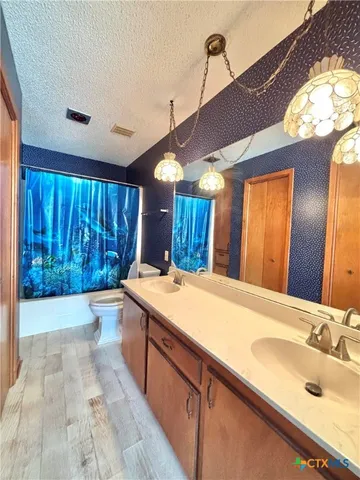 a bathroom with a tub and shower