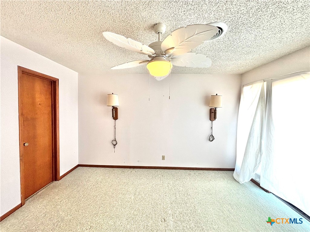 440 15th Street Port O'Connor, TX 77982 - Photo 22 of 40 a view of a room with wooden floor and window
