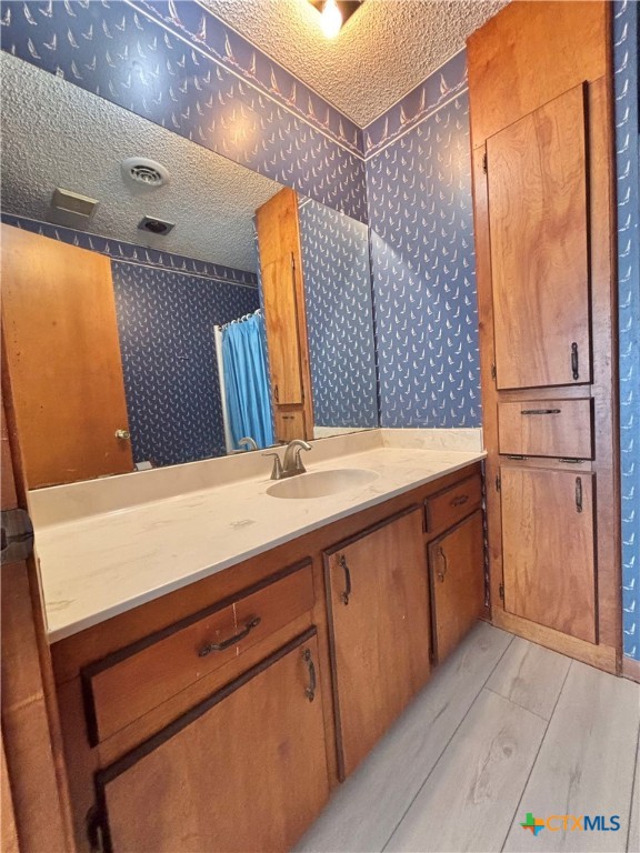 440 15th Street Port O'Connor, TX 77982 - Photo 27 of 40 a bathroom with a double vanity sink and a mirror