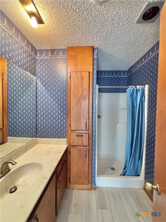 440 15th Street Port O'Connor, TX 77982 - Photo 29 of 40 a bathroom with a sink and a shower