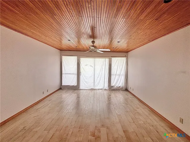 a view of a two chairs in the patio