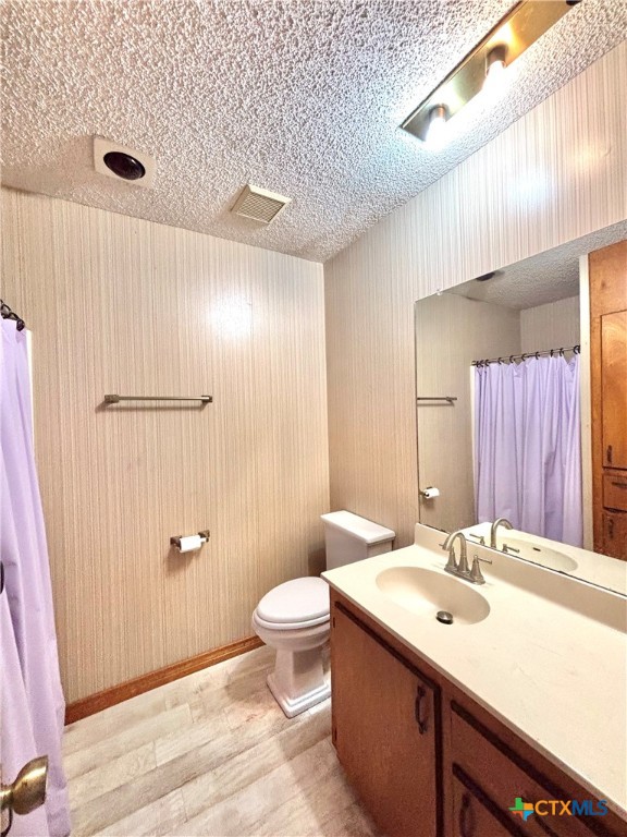 440 15th Street Port O'Connor, TX 77982 - Photo 34 of 40 a bathroom with a double vanity sink toilet and shower