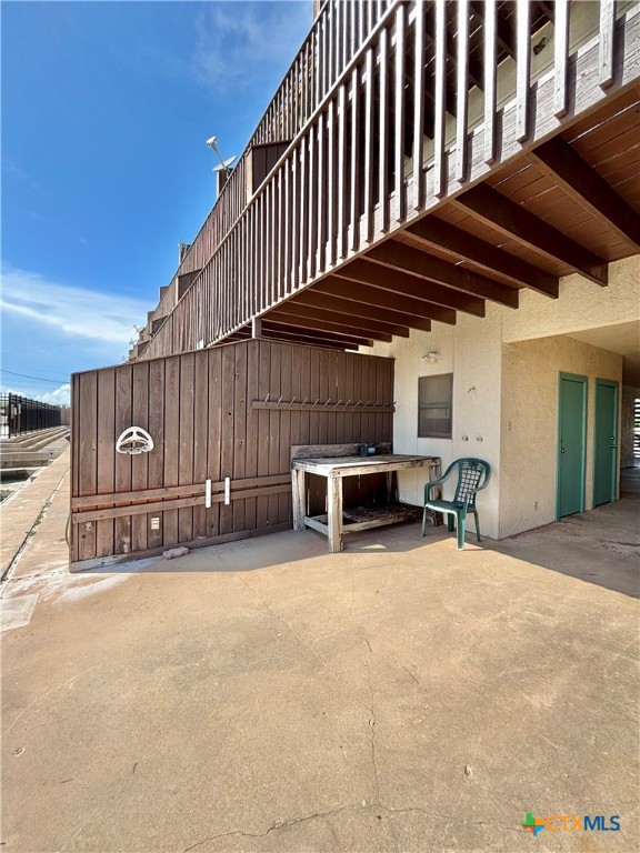 440 15th Street Port O'Connor, TX 77982 - Photo 36 of 40 a view of a chairs and table in the back yard of the house