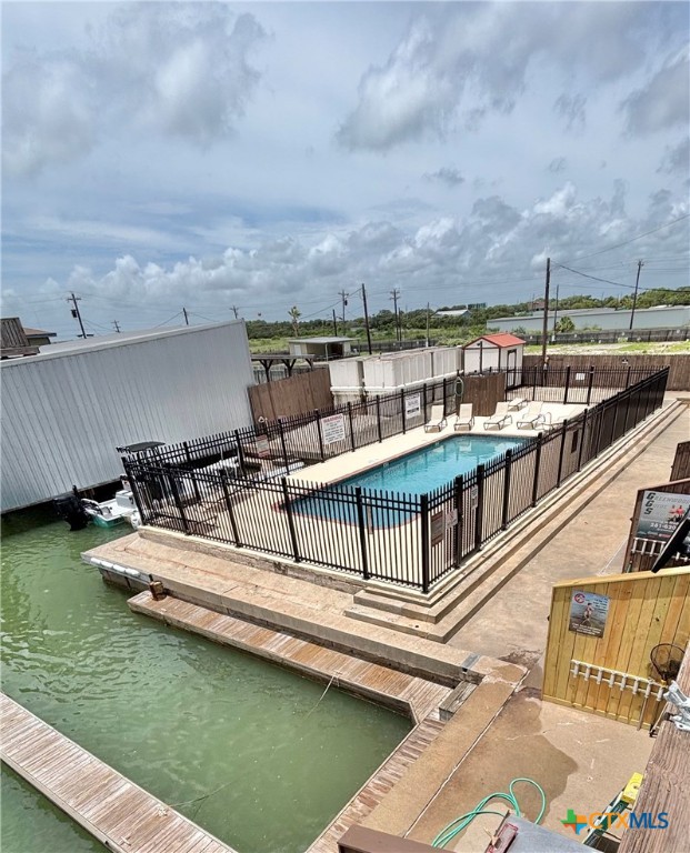 440 15th Street Port O'Connor, TX 77982 - Photo 5 of 40 a view of a swimming pool with a lake view