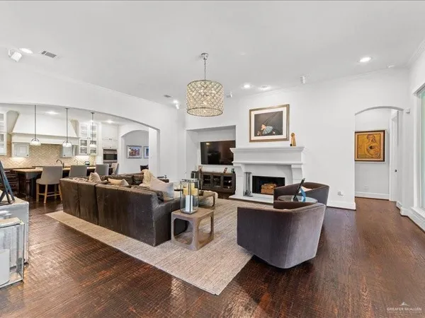 a living room with fireplace furniture and a flat screen tv