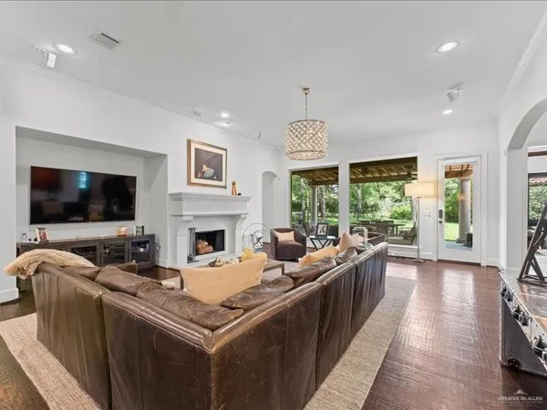 a living room with furniture fireplace and a flat screen tv